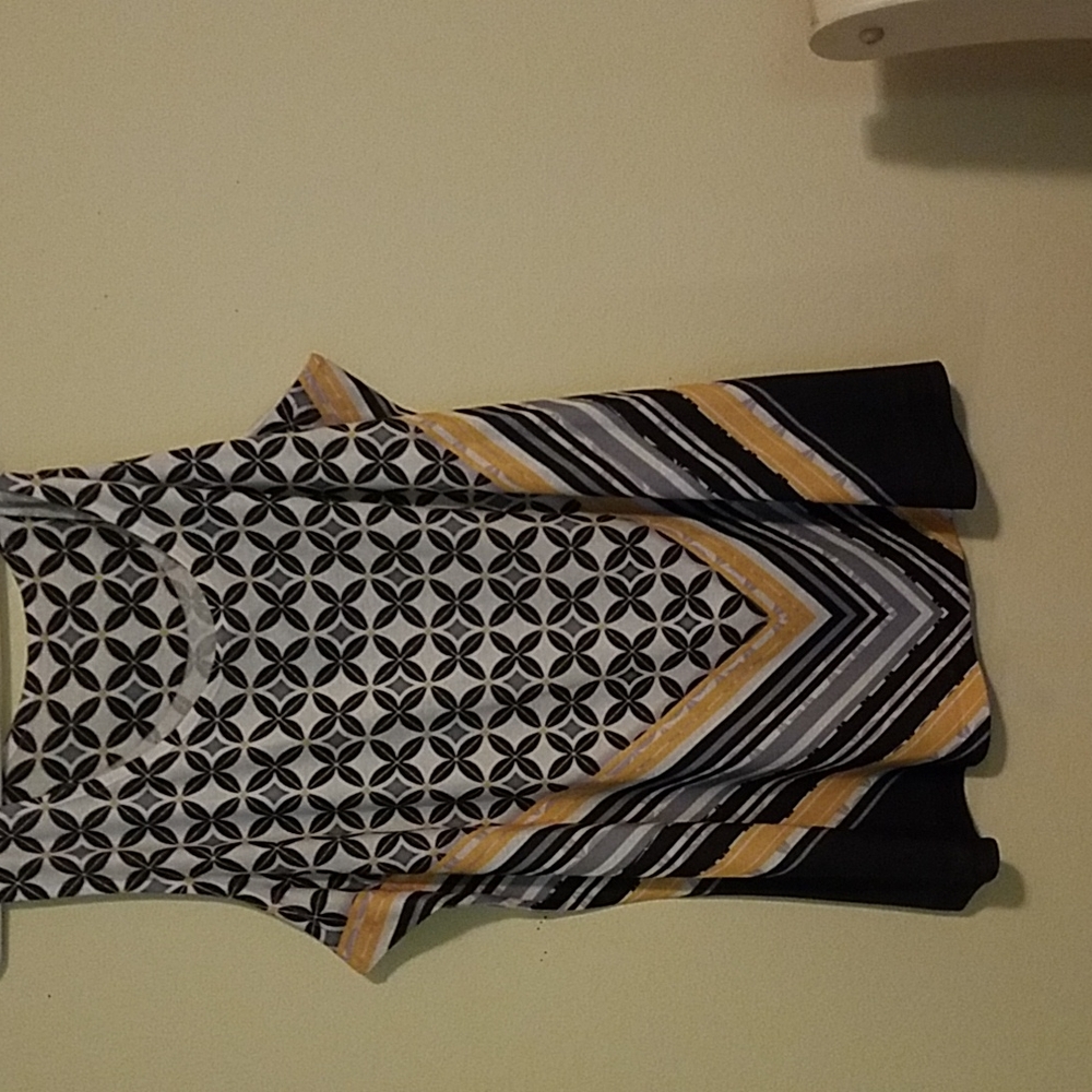 A two piece set,  sleeveless top  with an optional cardigan added.